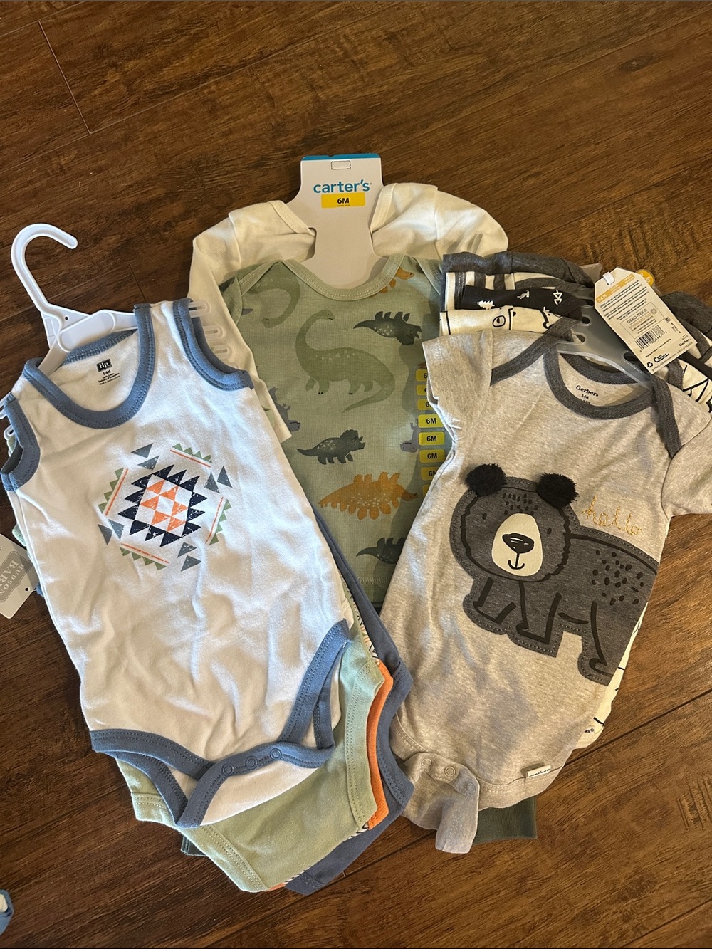 Carter's set, Gerber onesies set, and Hudson baby set.